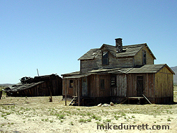 We recall these buildings as the ranch in ''Monte Walsh,'' making them among the oldest structures on the property. The barn is near collapse. The house is a heap. Lee Marvin would not be pleased. Photo copyright 2003-2004 Mike Durrett, all rights reserved.