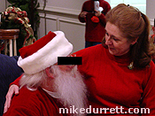 Photo: Mrs. D. caught with perpetrator in his oh so trendy red suit.